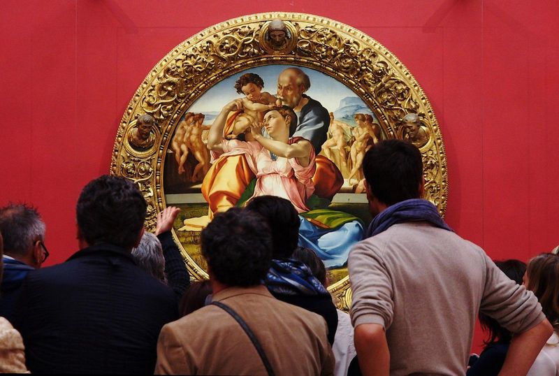 Visitors seeing Michelangelo's "The Holy Family" at the Uffizi Gallery