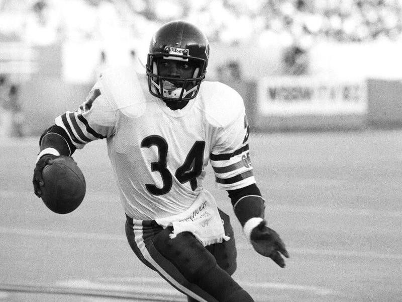 Walter Payton running with the football
