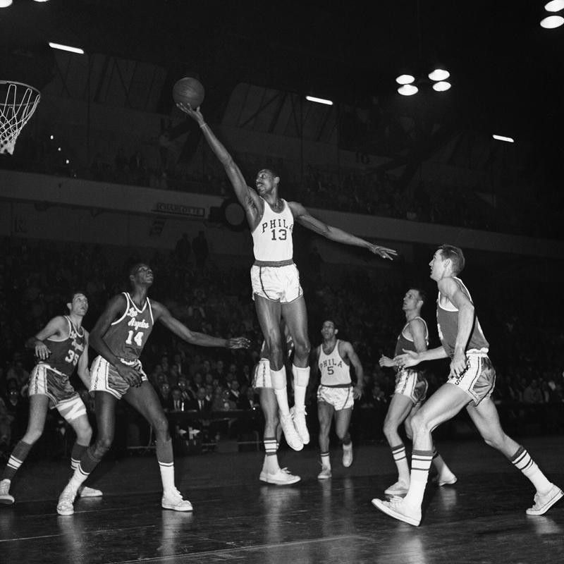Wilt Chamberlain stretches for basket
