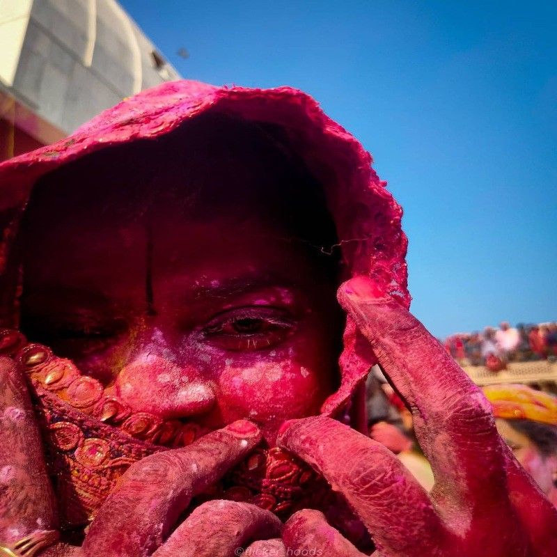 Woman covered in colors during Holi