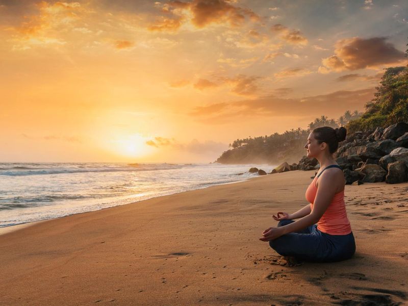 Woman doing yoga at beach