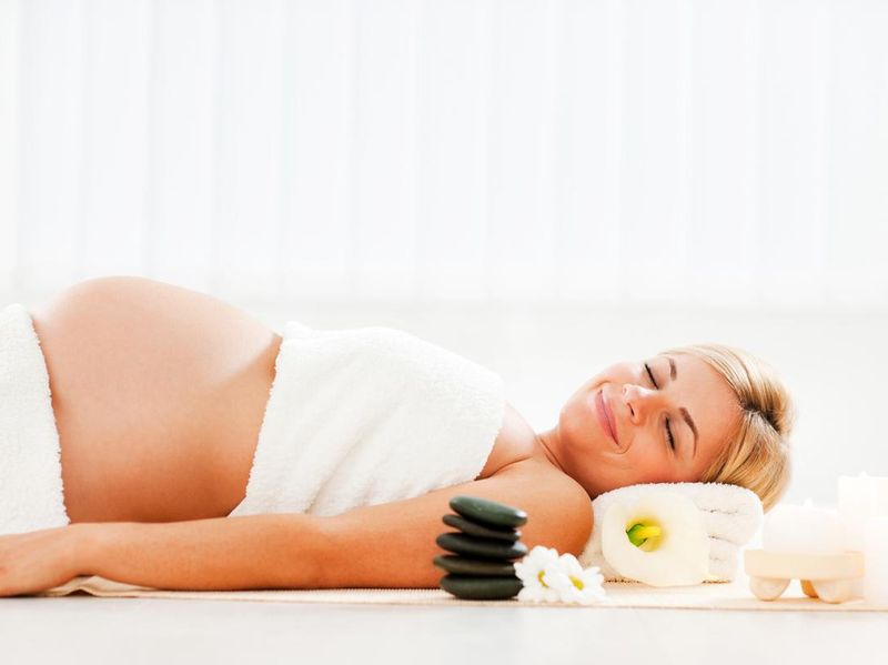 Woman enjoying prenatal massage