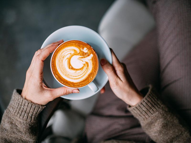 Woman Hand Holding cappuccino