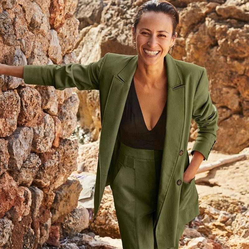 Woman smiling in green suit