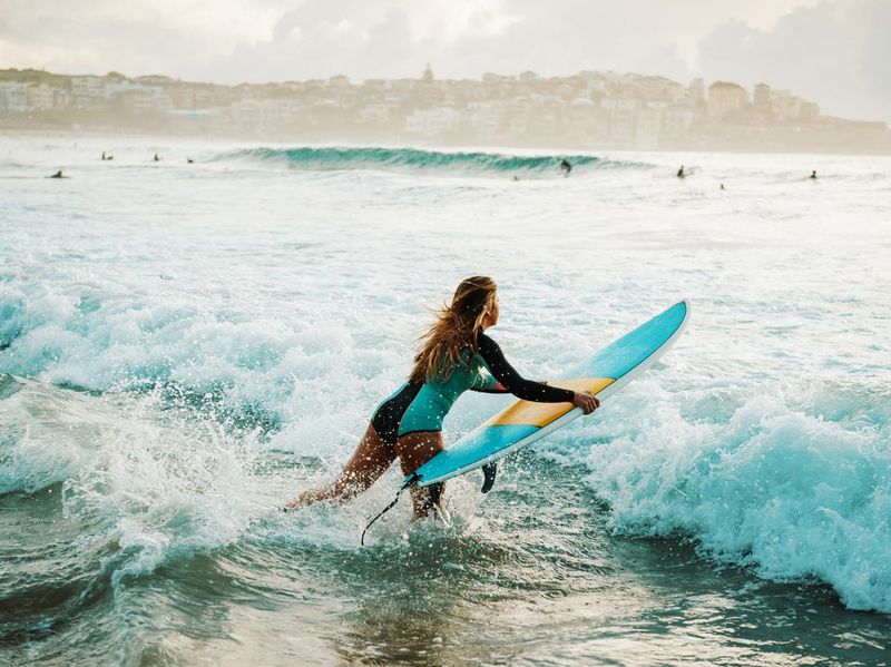 Woman surfer at Bondi beach