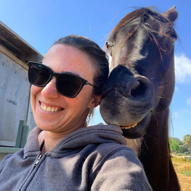 Woman Takes Selfie with Horse Smiling