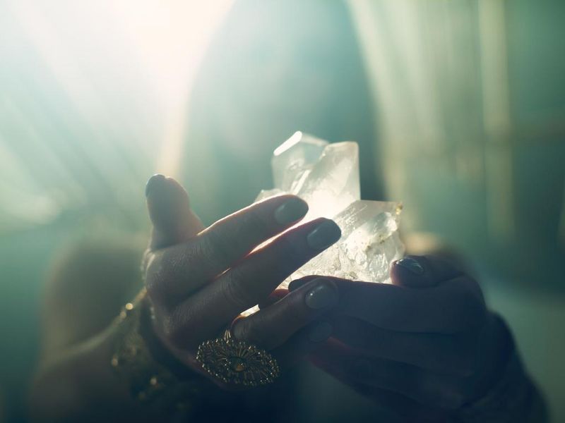 Woman's hand with a healing crystal