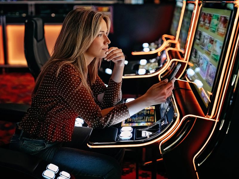 Women gambling on slot machiner