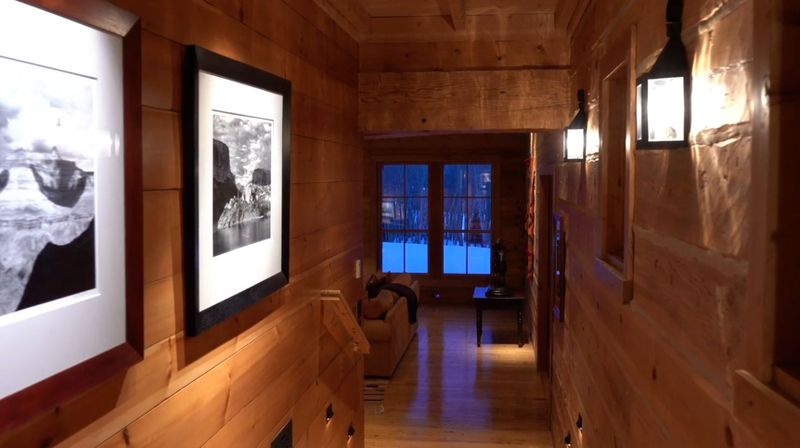 Wood hallway with white pictures