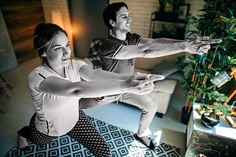 Young couple doing workout at home
