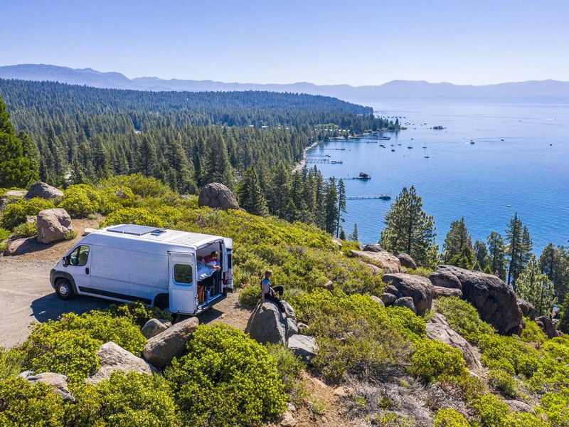 Young Couple Parked Van at a Viewpoint of Lake Tahoe