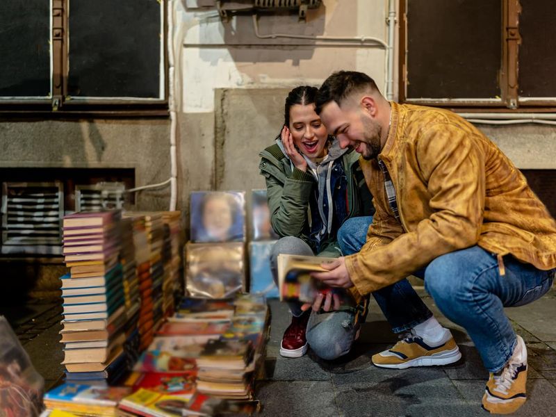 Young Couple's Shared Love for Old Books and Music Records Shines Through