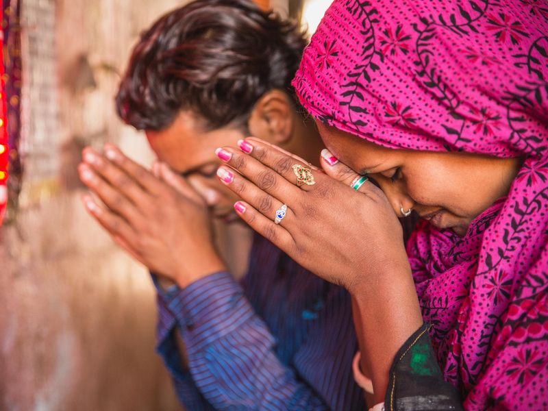Young Indian couple praying