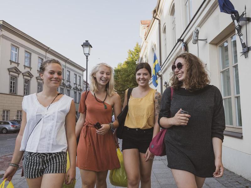Young women walking in Old Town of Vilnius, Lithuania