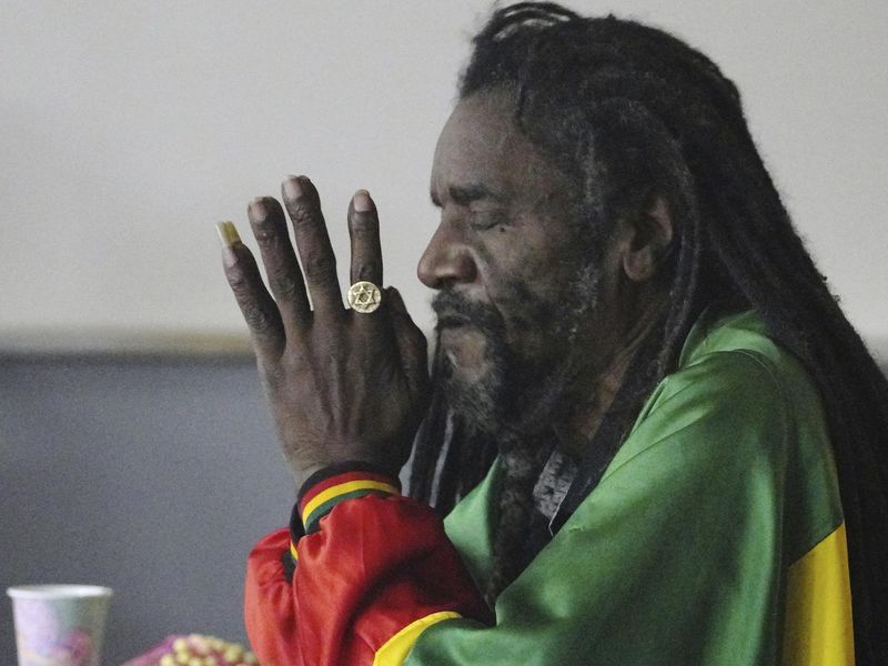 Zack Scott prays during an event by the Rastafari Coalition marking the 91st anniversary of the coronation of the late Ethiopian Emperor Haile Selassie I in Columbus, Ohio