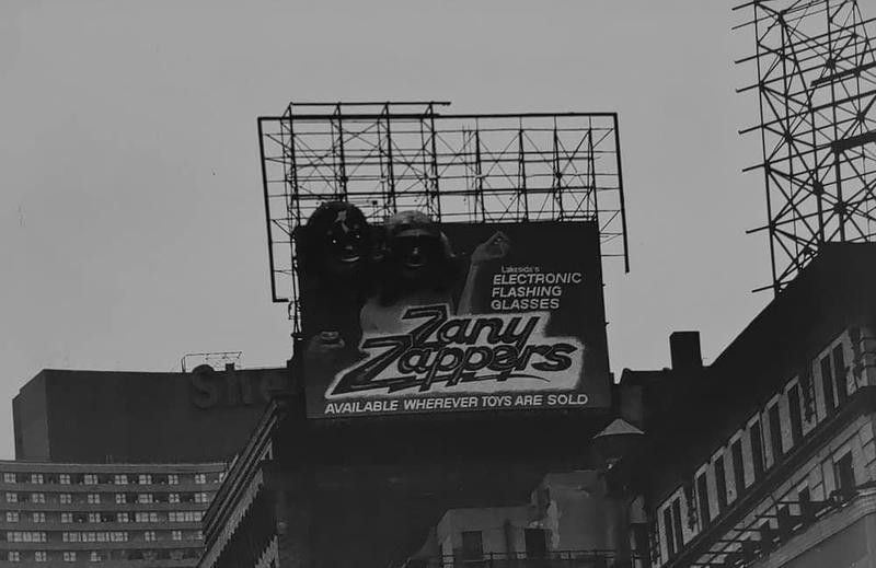 Zany Zappers billboard on building