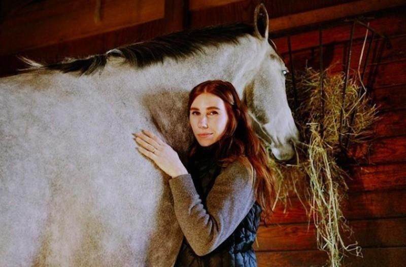 Zosia Mamet poses with horse